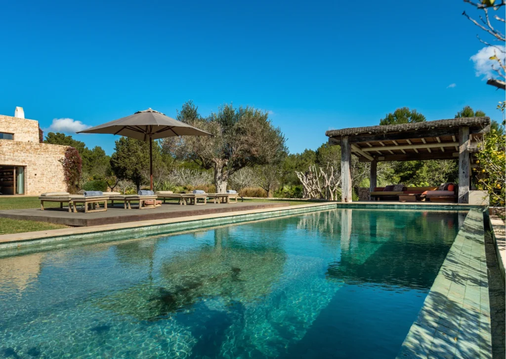 Pool area of Elegant Escape, a sophisticated luxury villa for rent in San Carlos Ibiza