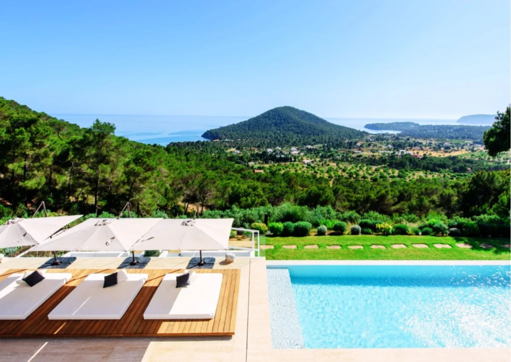 Infinity pool with Mediterranean sea views at Hedonist Heights luxury villa rental in Ibiza.
